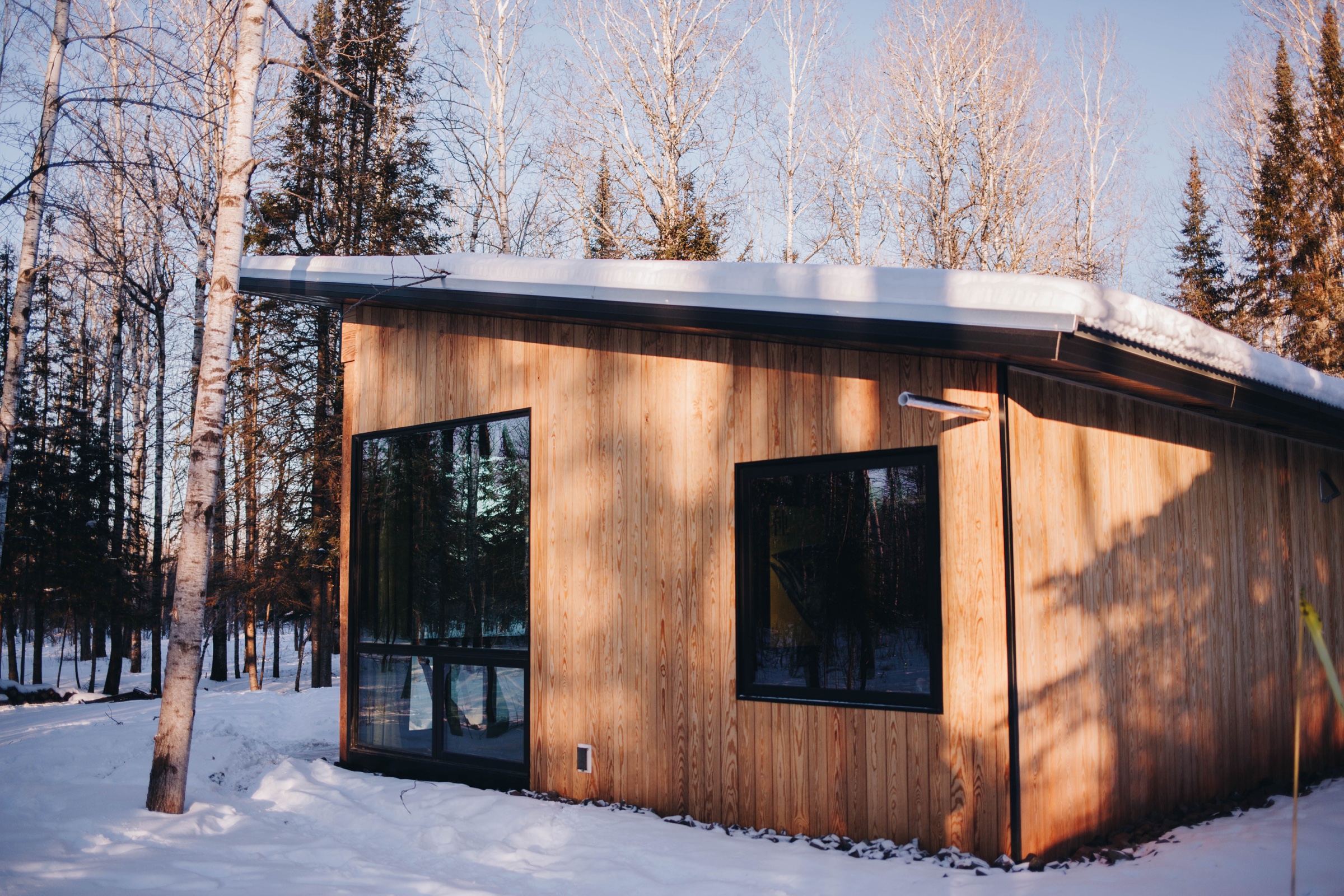 Sölveig Sentō cedar-clad exterior in winter sunlight with snow